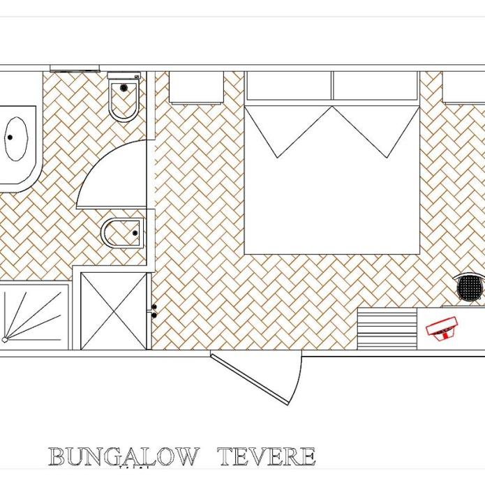 Compacte bungalow met slaapkamer, badkamer en kleine keuken.
